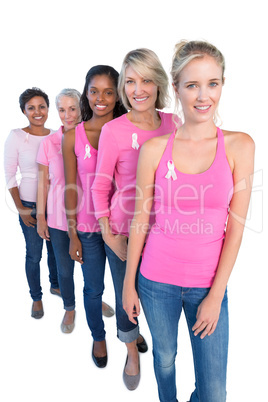 Happy women wearing pink and ribbons for breast cancer