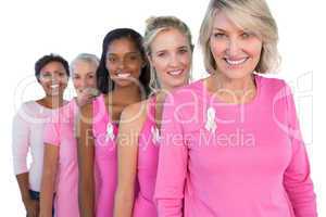 Cheerful women wearing pink and ribbons for breast cancer