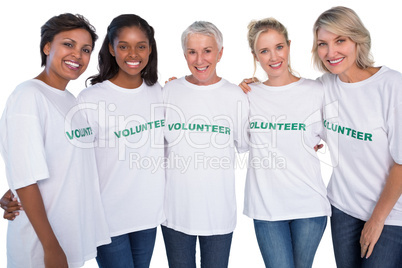 Group of female volunteers smiling at camera