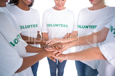 Group of female volunteers with hands together