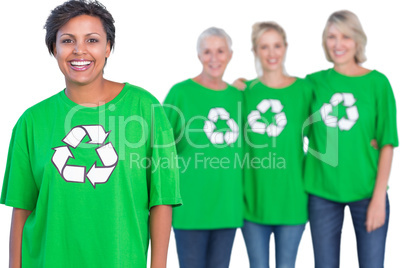 Happy women wearing green recycling tshirts