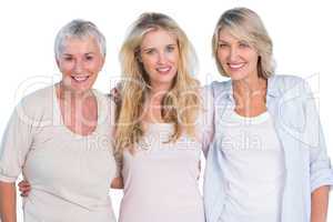 Three generations of  happy women smiling at camera