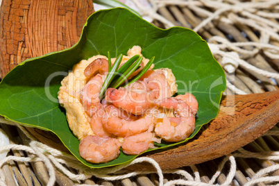 Portion of shrimps on a nasturtium leaf