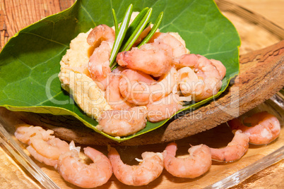 Grilled shrimps on a nasturtium leaf