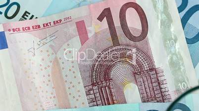 Euro banknote identification with magnifying glass