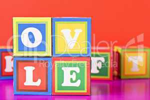 word "love" made from baby blocks