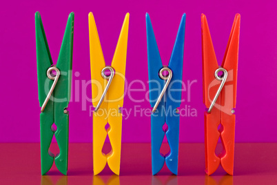 four colorful clothespins