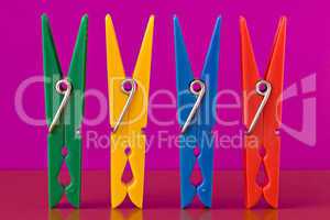 four colorful clothespins