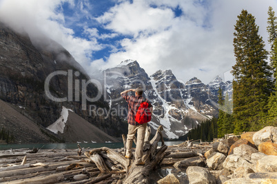 Hiking Man Looking at Moraine Lake & Rocky Mountains