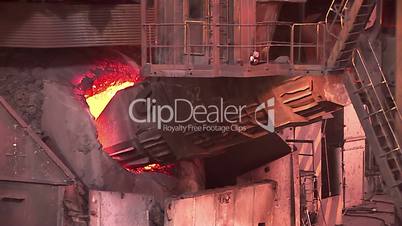 Iron and Steel Works. Converter plant. Loading scrap metal into a melting furnace.