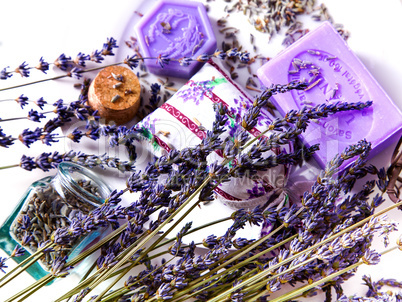Lavender flowers with soap and glass