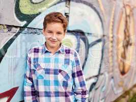 Portrait of the teenager boy in outdoors