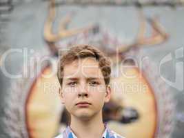 Portrait of the teenager boy in outdoors