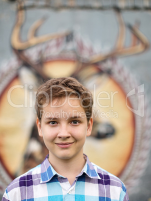 Portrait of the teenager boy in outdoors