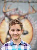 Portrait of the teenager boy in outdoors