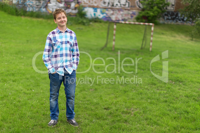 Portrait of the teenager boy in outdoors