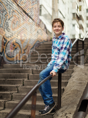 Portrait of the teenager boy in outdoors