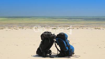 backpacks on the beach
