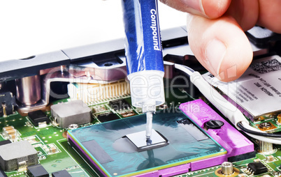 Applying thermal compound on video chip with syringe close view