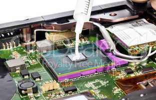 Thermal compound in syringe and laptop video chip