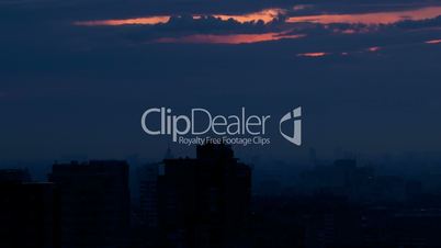 Sunrise over the city. Time lapse with panning.