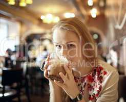 girl is drinking slat in cafe