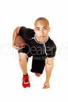 Football player kneeling.