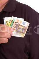 Man pushes money into his breast pocket