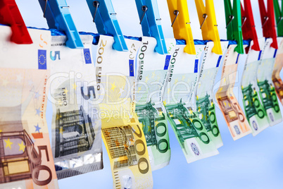 Banknotes hanging on a clothesline