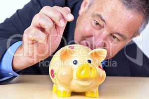 Man's money in his piggy bank