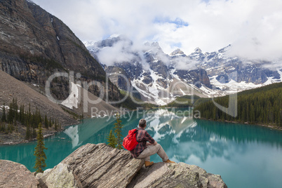 Hiking Man Looking at Moraine Lake & Rocky Mountains