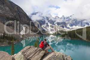 Hiking Man Looking at Moraine Lake & Rocky Mountains