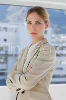 Businesswoman with arms crossed in her office