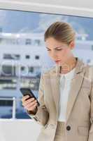 Businesswoman looking at her smartphone