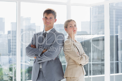Business colleagues standing in their office