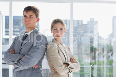 Serious business colleagues standing together