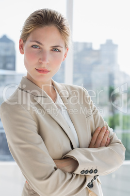 Businesswoman standing with arms crossed