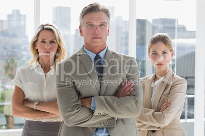 Three business people standing together