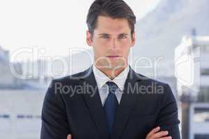 Businessman standing with arms crossed