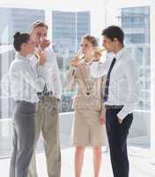 Team of business people drinking champagne