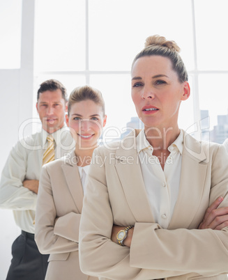 Attractive businesswoman standing with arms crossed