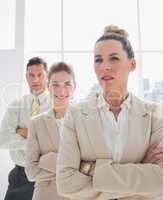 Attractive businesswoman standing with arms crossed