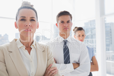 Serious attractive businesswoman standing with arms crossed