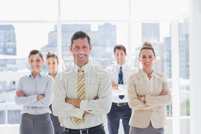 Smiling handsome businessman with his team