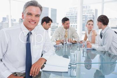 Smiling businessman in a meeting