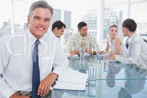 Smiling businessman in a meeting