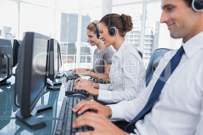 Group of call center agents working in line
