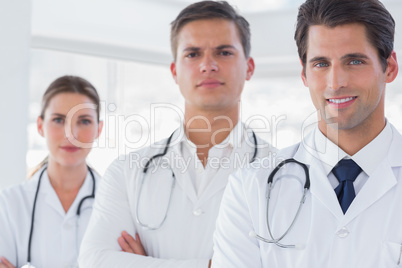 Three doctors with lab coats