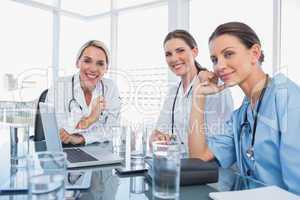 Three smiling women doctors