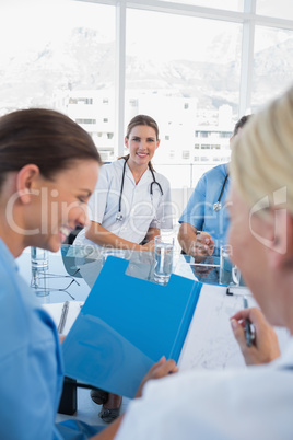 Smiling doctor in a meeting room